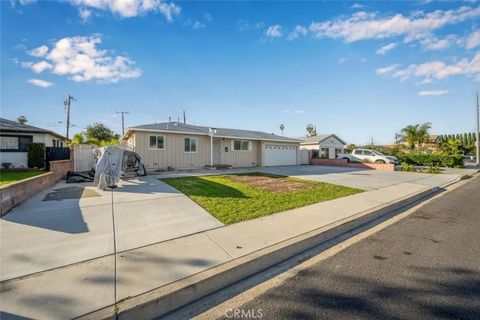 Photo of 11721 Palmwood Drive, Garden Grove, CA 92840 (MLS # PW26004131)
