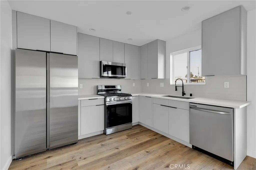 Photo of 1736 Carmona Avenue #A, Los Angeles, CA 90019 (MLS # BB26089575)