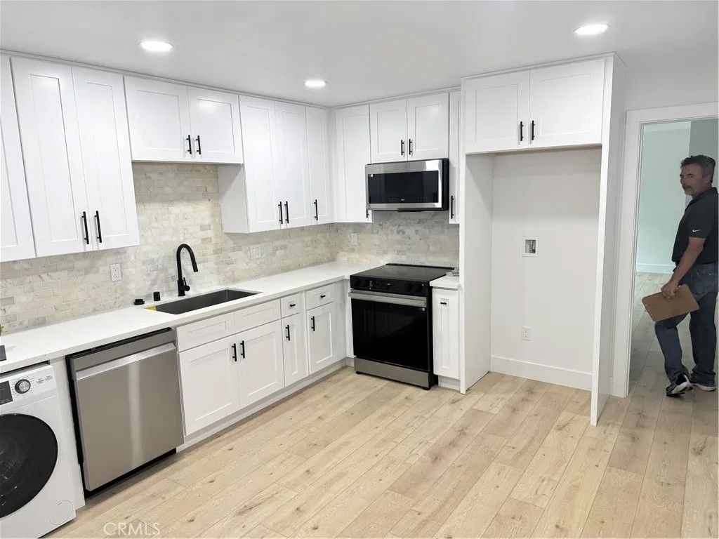 Photo of 17422 Keelson Ln #3, Huntington Beach, CA 92647 (MLS # PW26019997)