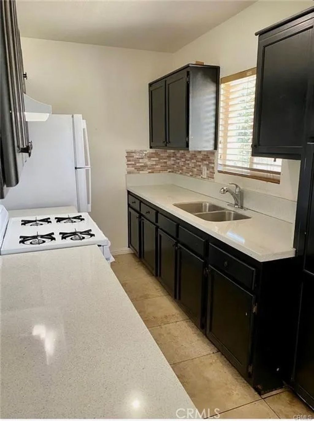 Photo of 1303 W 109th St, Los Angeles, CA 90044 (MLS # NP26005887)