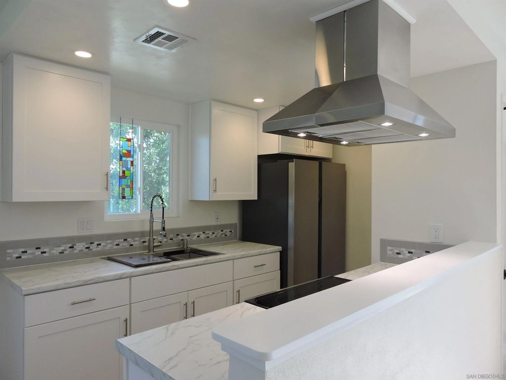 Photo of 9855 Mission Greens Ct #4, Santee, CA 92071 (MLS # 260003498)