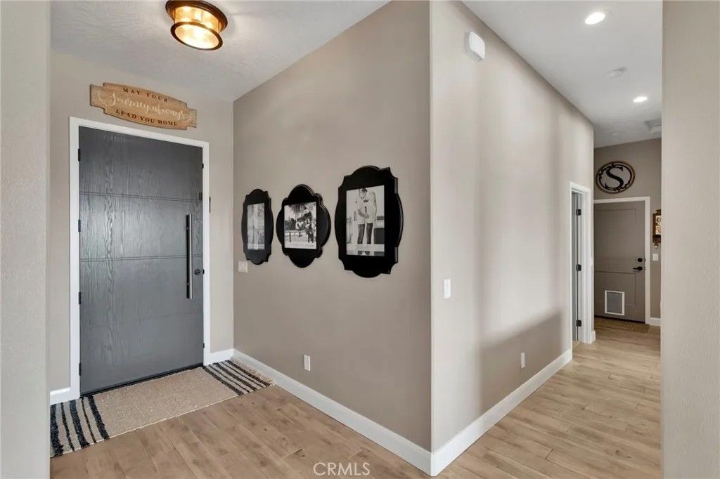 Photo of 9817 Silver Palm Dr, Oak Hills, CA 92344 (MLS # HD25272224)