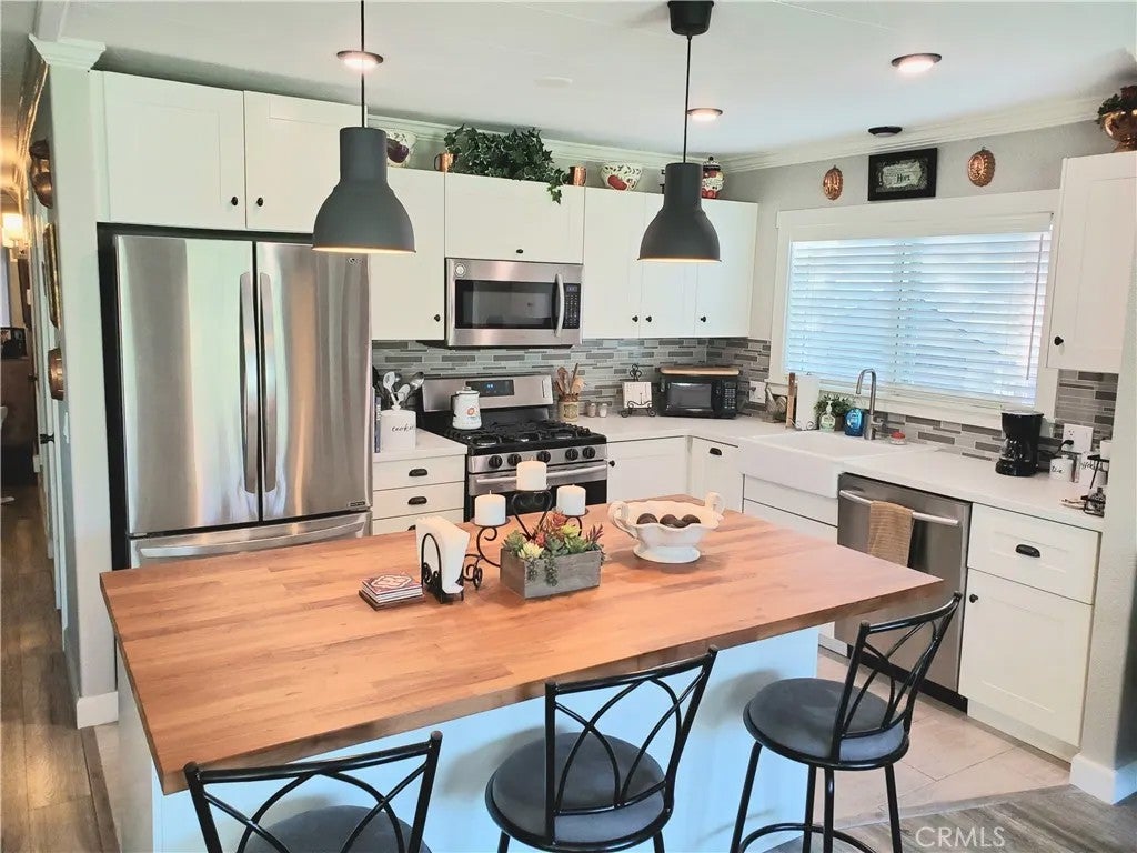 Photo of 30761 Paradise Palm Ave, Homeland, CA 92548 (MLS # IG26118867)