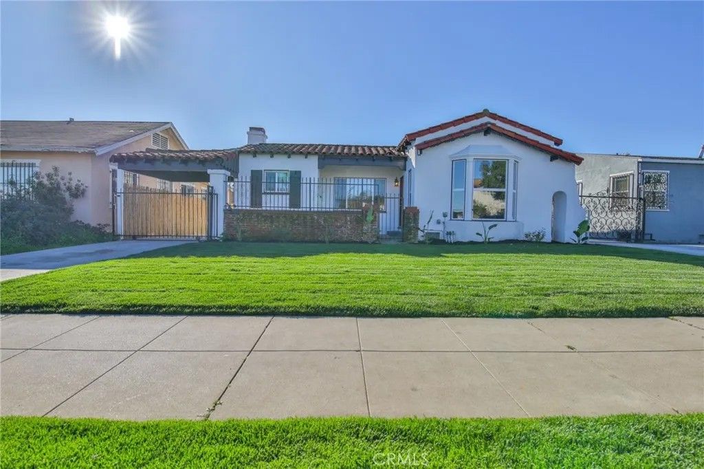 Photo of 1618 W 80th St, Los Angeles, CA 90047 (MLS # DW26005766)