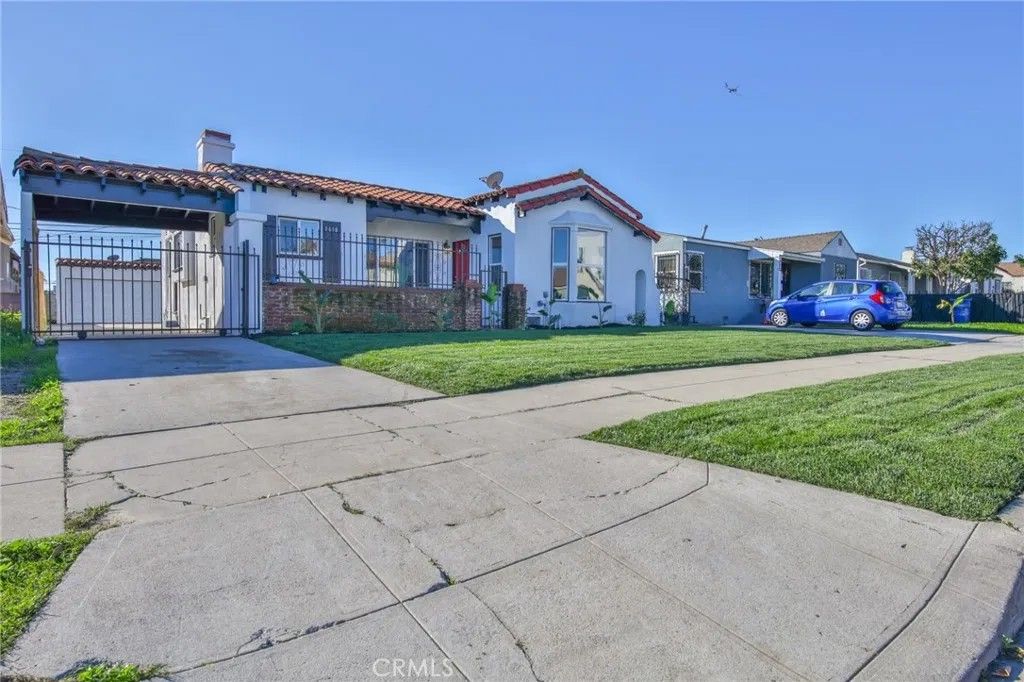 Photo of 1618 W 80th St, Los Angeles, CA 90047 (MLS # DW26005766)