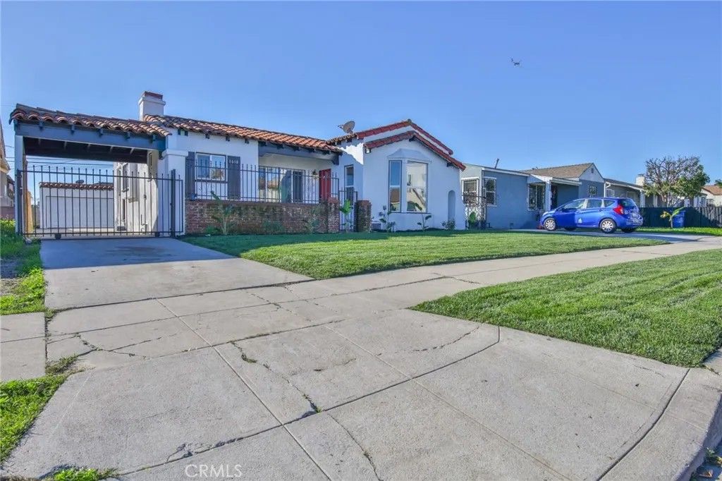 Photo of 1618 W 80th St, Los Angeles, CA 90047 (MLS # DW26005766)