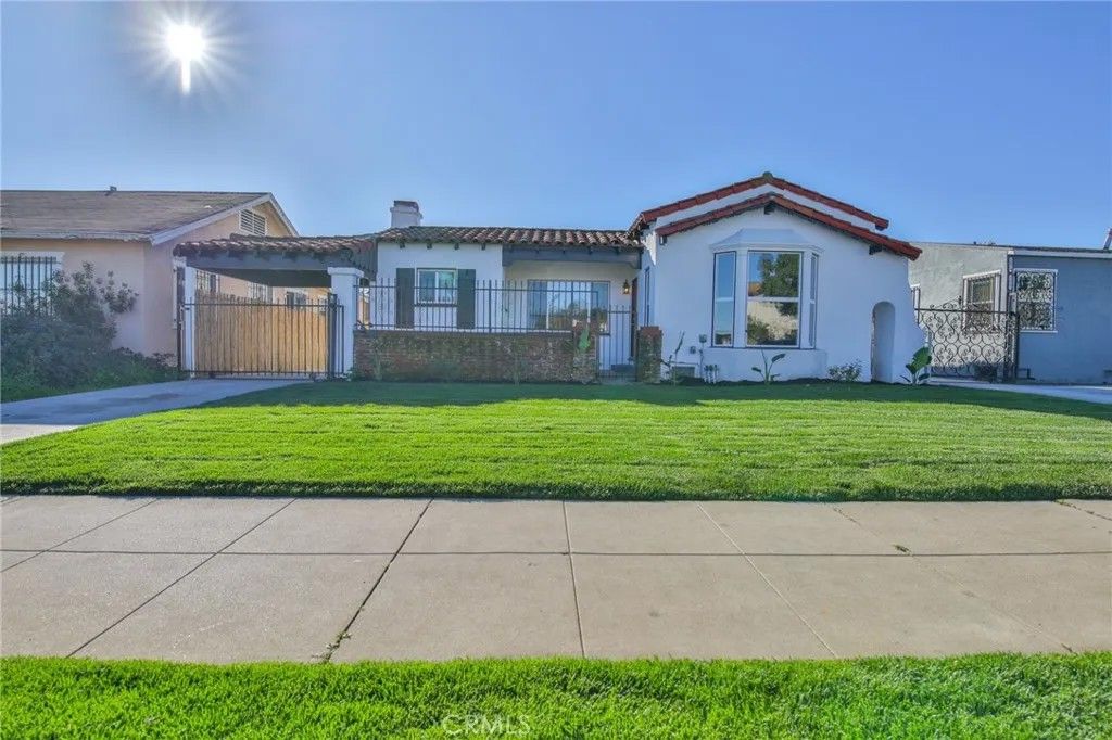 Photo of 1618 W 80th St, Los Angeles, CA 90047 (MLS # DW26005766)