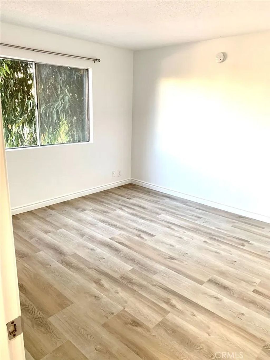 Photo of 8505 Columbus Ave #210, North Hills, CA 91343 (MLS # PW26043909)