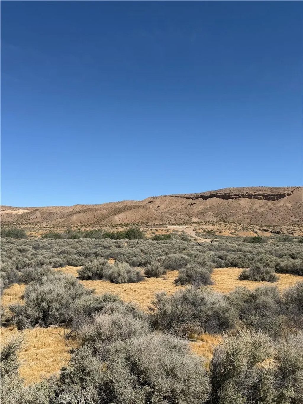 Photo of 31980 Nelson Rd, Barstow, CA 92311 (MLS # HD26072929)