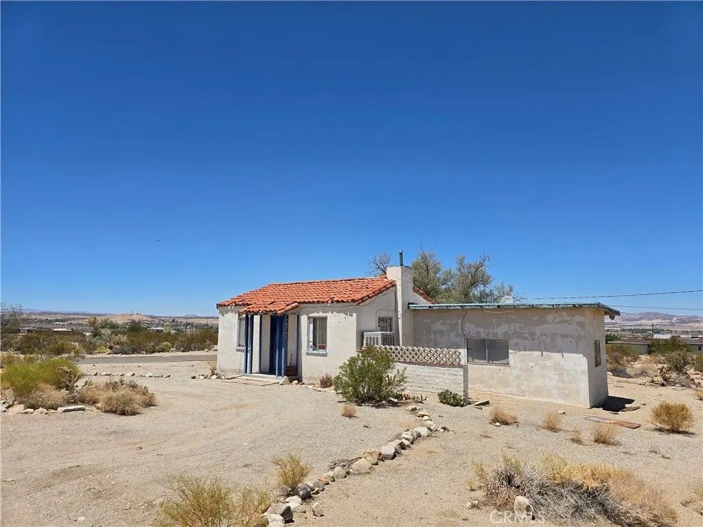 Photo of 74706 Sunset Drive, 29 Palms, CA 92277 (MLS # JT25271410)
