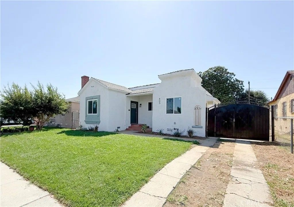 Photo of 405 S Bradfield Avenue, Compton, CA 90221 (MLS # IG25271247)