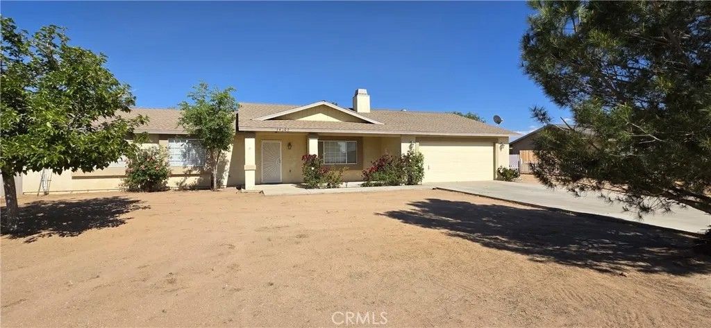 Photo of 14307 Tonikan Rd, Apple Valley, CA 92307 (MLS # IV26092694)