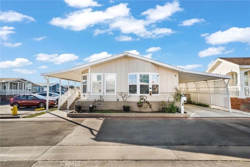 Photo of 9850 Garfield Ave #110, Huntington Beach, CA 92646 (MLS # OC26016068)