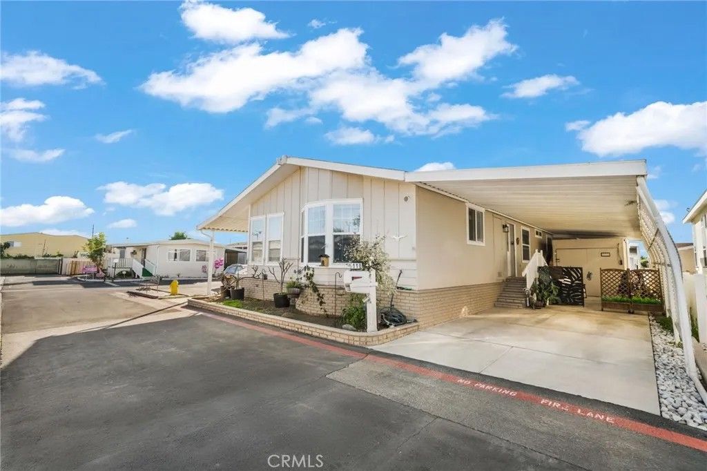 Photo of 9850 Garfield Ave #110, Huntington Beach, CA 92646 (MLS # OC26016068)