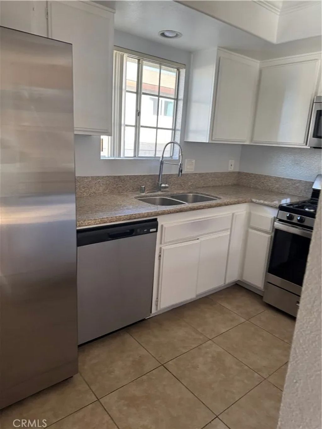 Photo of 16331 Cornuta Ave #F, Bellflower, CA 90706 (MLS # PW26008650)