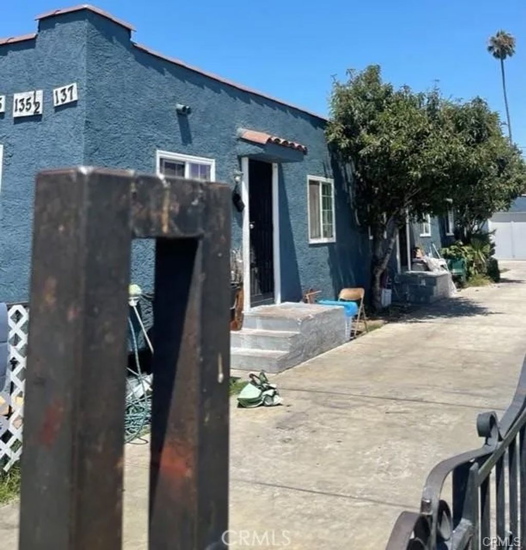 Photo of 135 E 77th St, Los Angeles, CA 90003 (MLS # DW26008793)