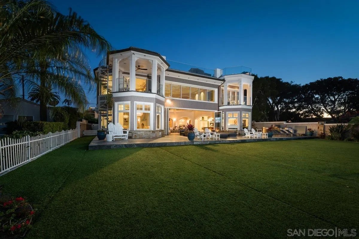 Step through the custom glass front door, etched with the San Diego sk – image 60