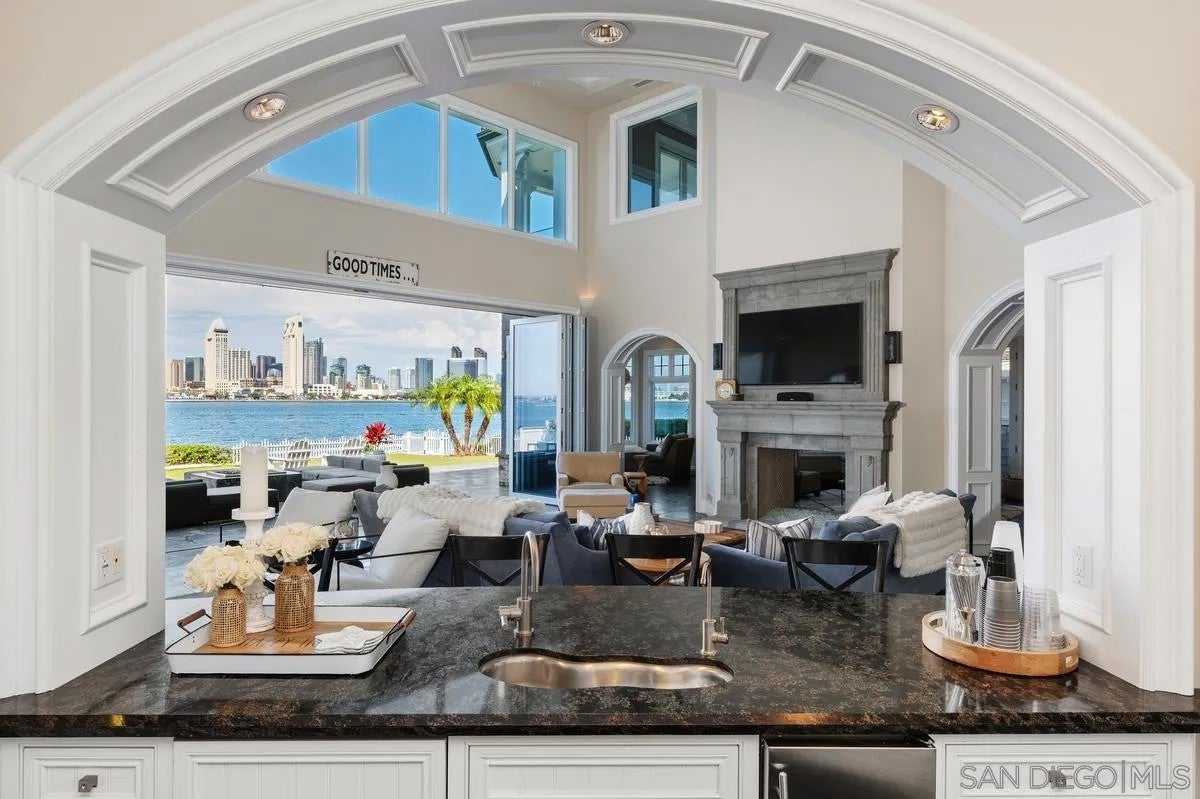 Step through the custom glass front door, etched with the San Diego sk – image 13