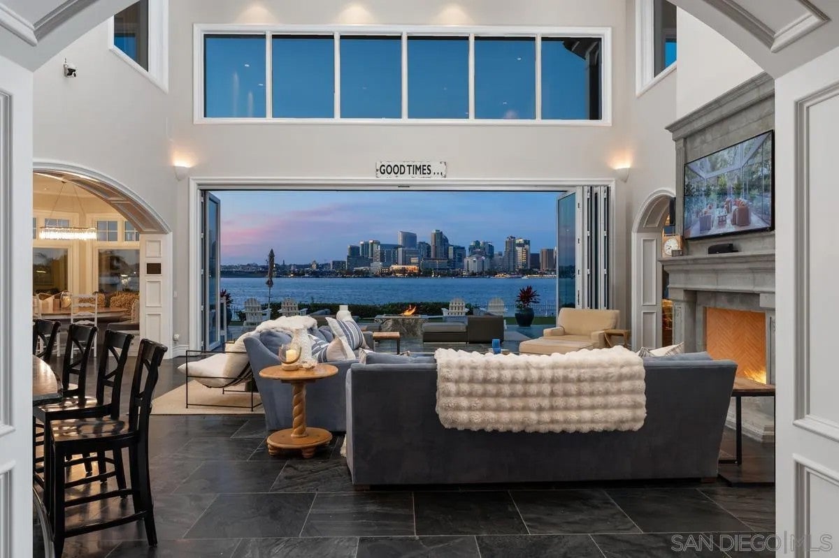 Step through the custom glass front door, etched with the San Diego sk – image 9