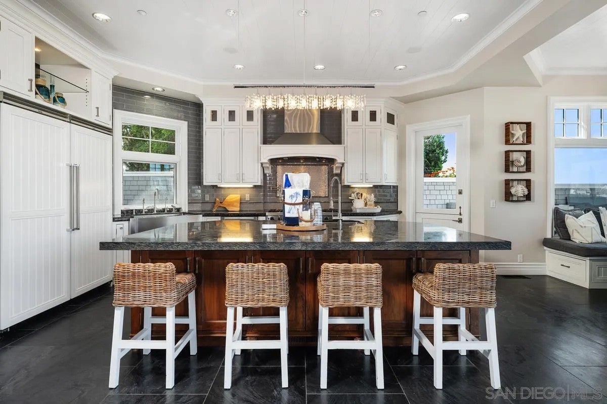 Step through the custom glass front door, etched with the San Diego sk – image 16