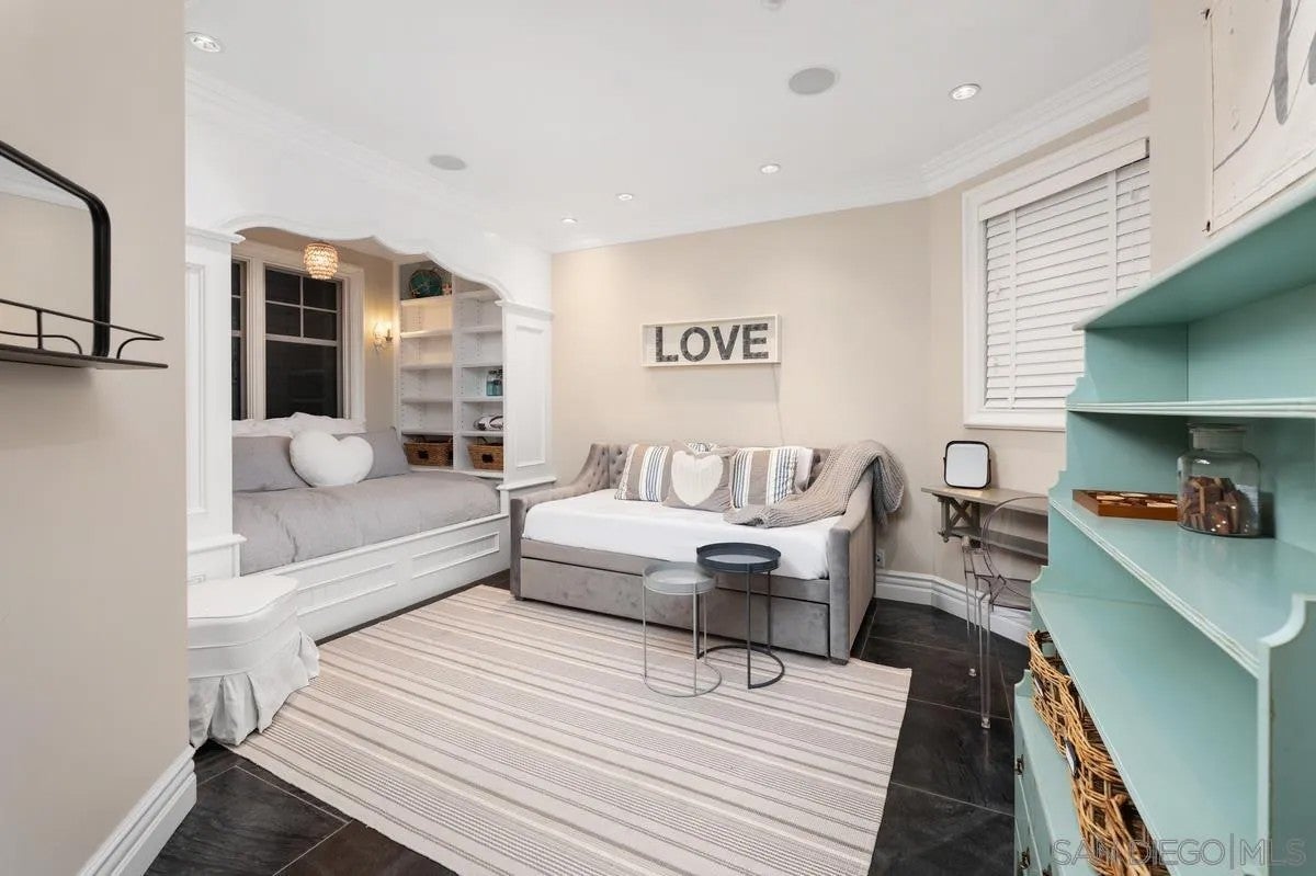 Step through the custom glass front door, etched with the San Diego sk – image 49