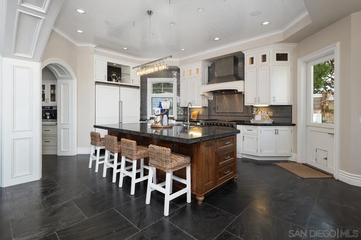 Step through the custom glass front door, etched with the San Diego sk – image 15