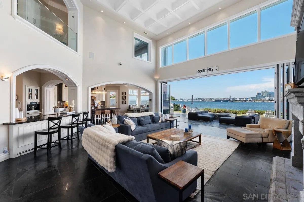 Step through the custom glass front door, etched with the San Diego sk – image 11
