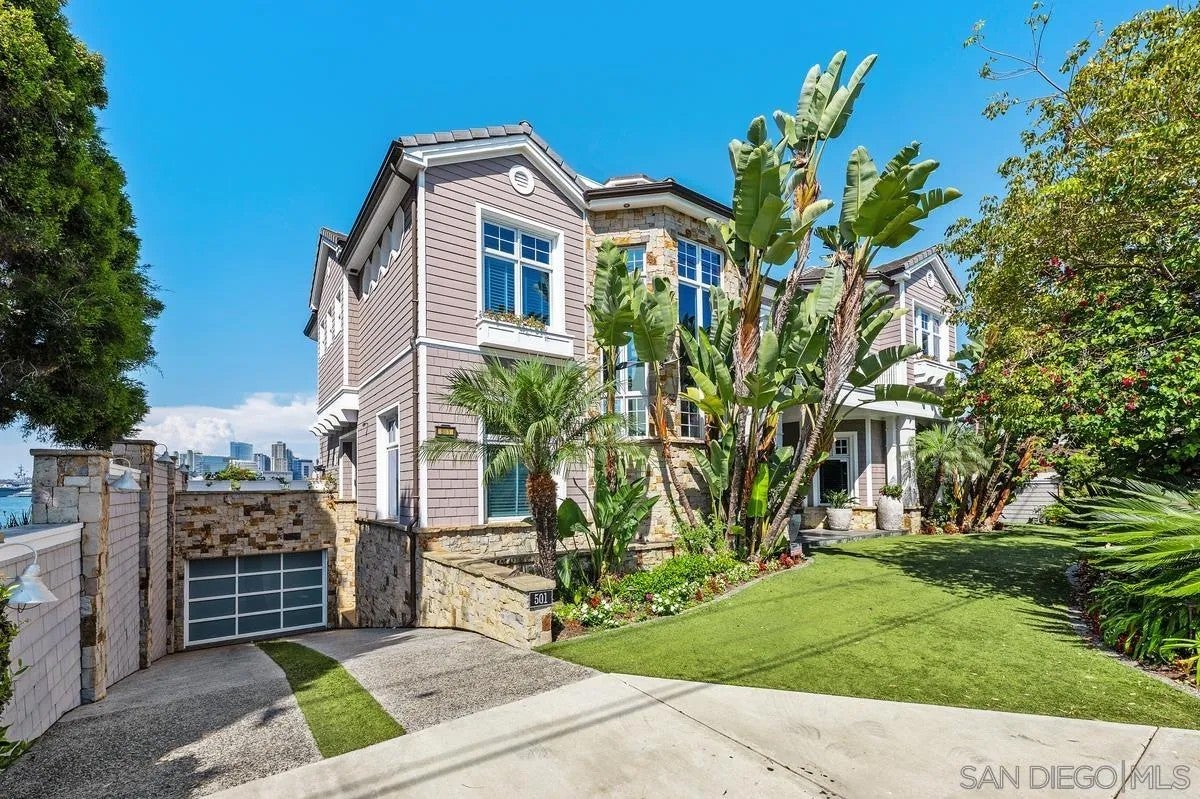 Step through the custom glass front door, etched with the San Diego sk – image 6