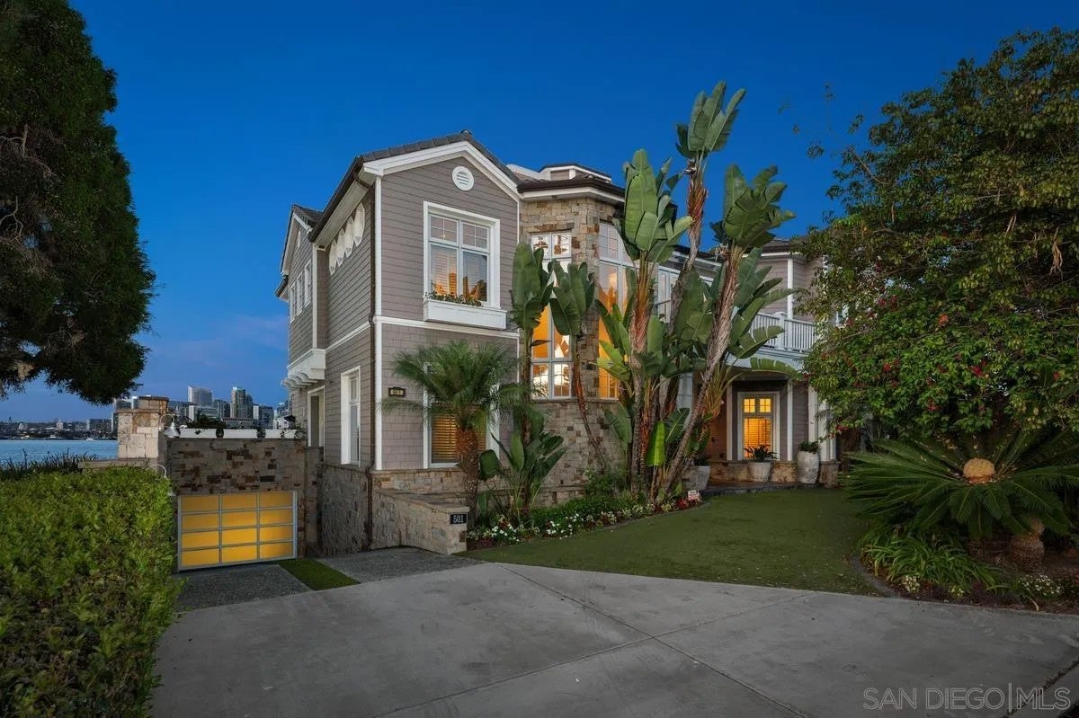 Step through the custom glass front door, etched with the San Diego sk – image 61