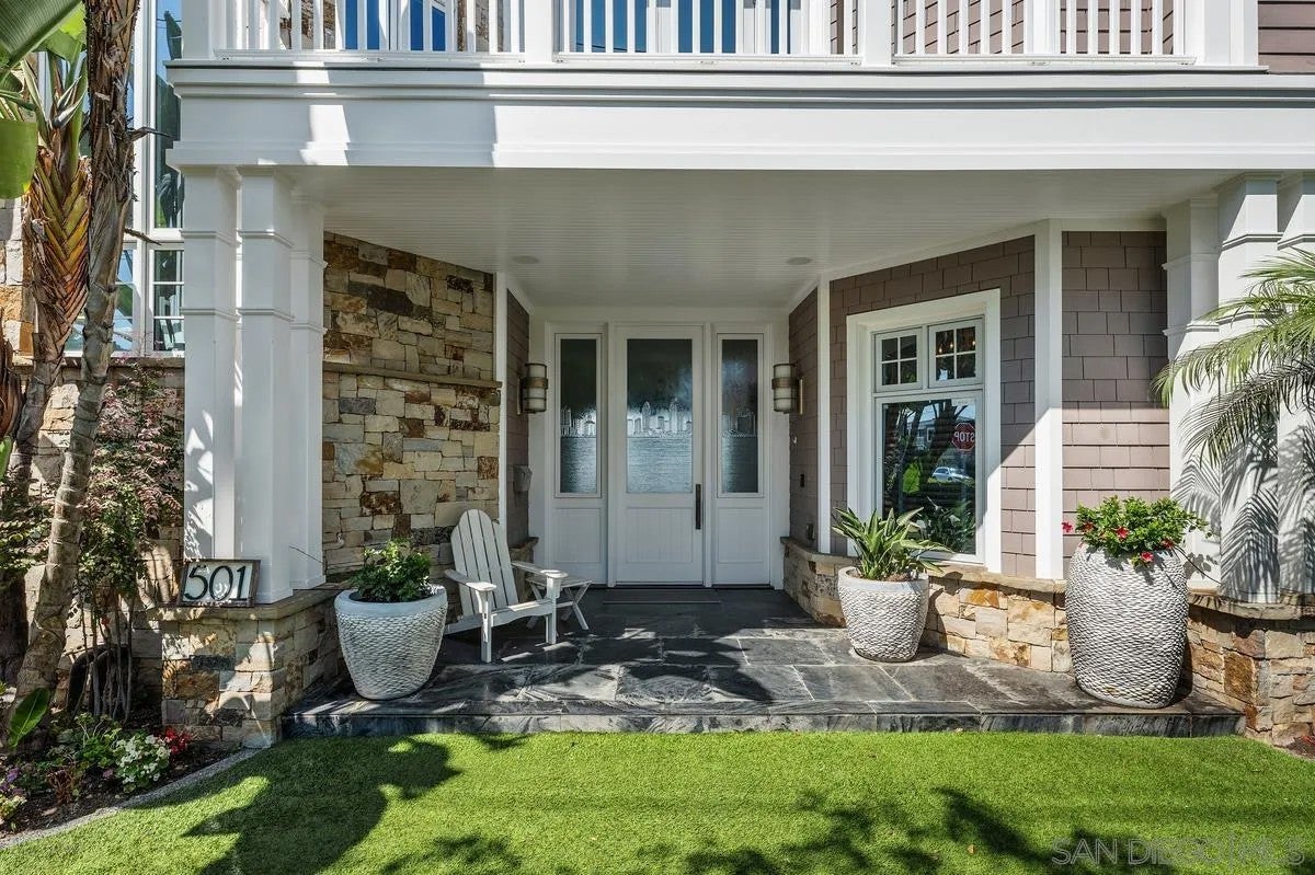 Step through the custom glass front door, etched with the San Diego sk – image 7