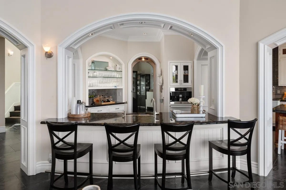 Step through the custom glass front door, etched with the San Diego sk – image 12