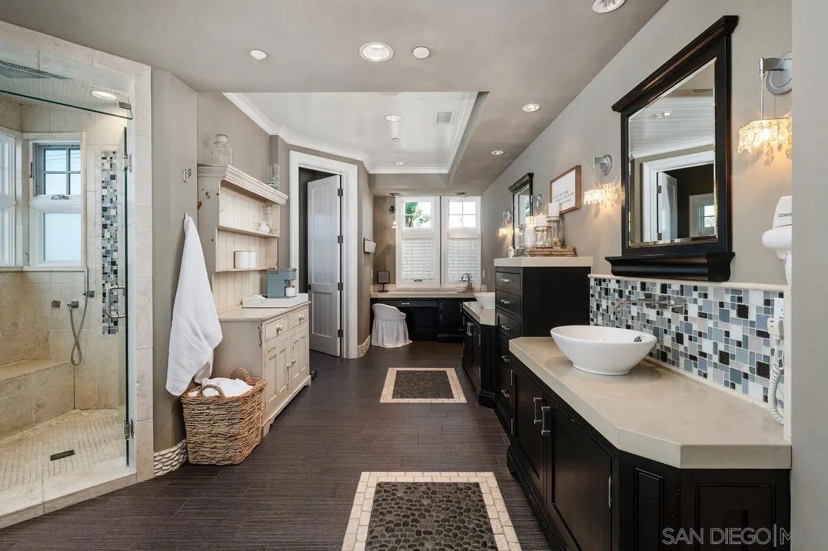 Step through the custom glass front door, etched with the San Diego sk – image 38