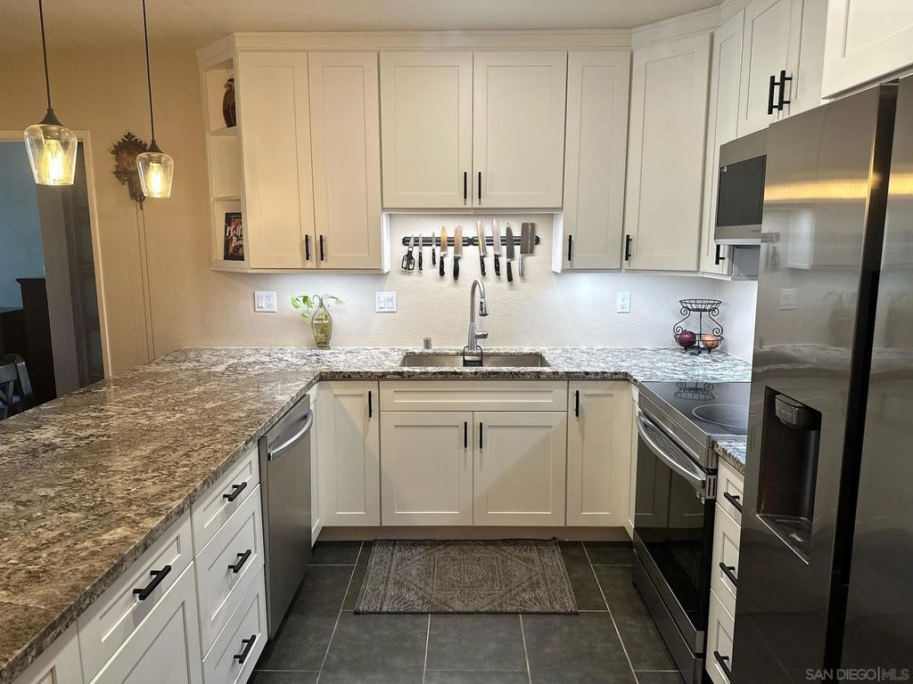 Photo of 425 Autumn Dr #25, San Marcos, CA 92069 (MLS # 260003639)