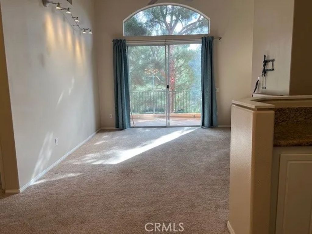 Photo of 2103 Ladrillo Aisle #88, Irvine, CA 92606 (MLS # OC25255759)