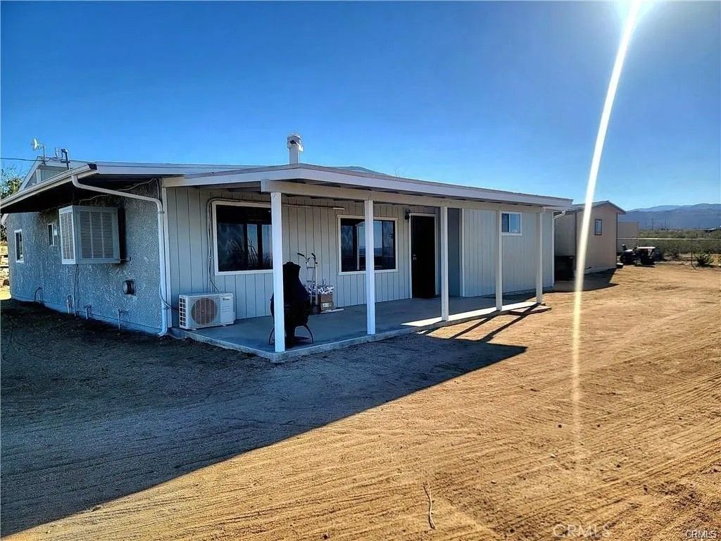 Photo of 5566 Oleta Rd, Landers, CA 92285 (MLS # HD26048201)