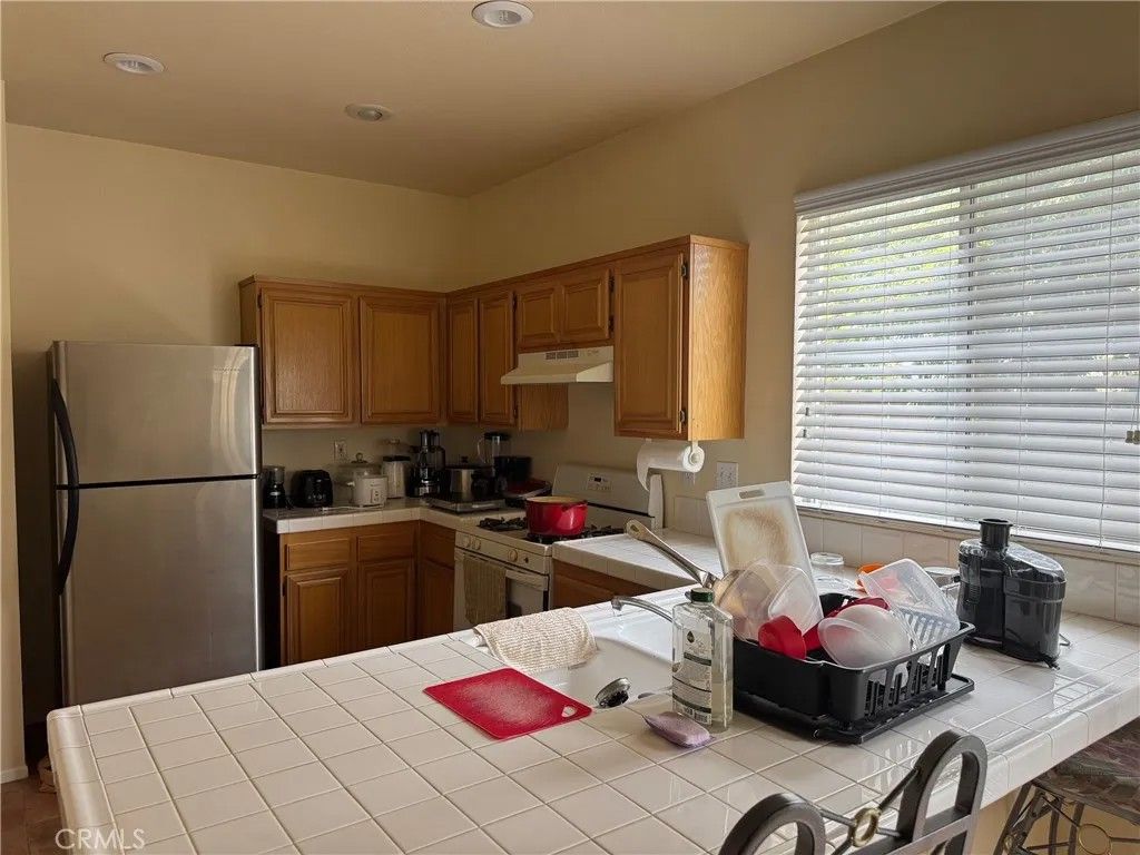 Photo of 14685 Muirfield Avenue, Moreno Valley, CA 92555 (MLS # IG25259263)