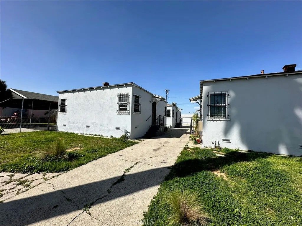 Photo of 1315 W 102nd Street, Los Angeles, CA 90044 (MLS # PW25014640)