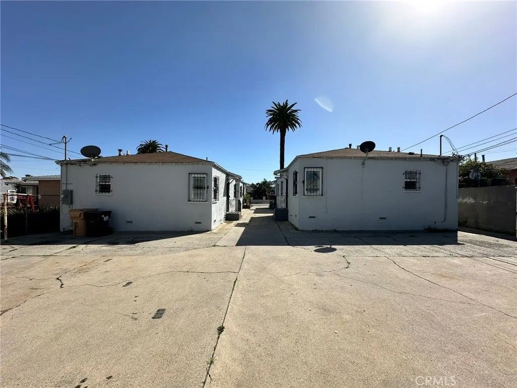 Photo of 1315 W 102nd Street, Los Angeles, CA 90044 (MLS # PW25014640)
