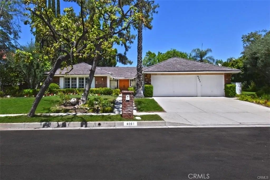 Photo of 4061 Falling Leaf, Encino, CA 91316 (MLS # SR25273837)