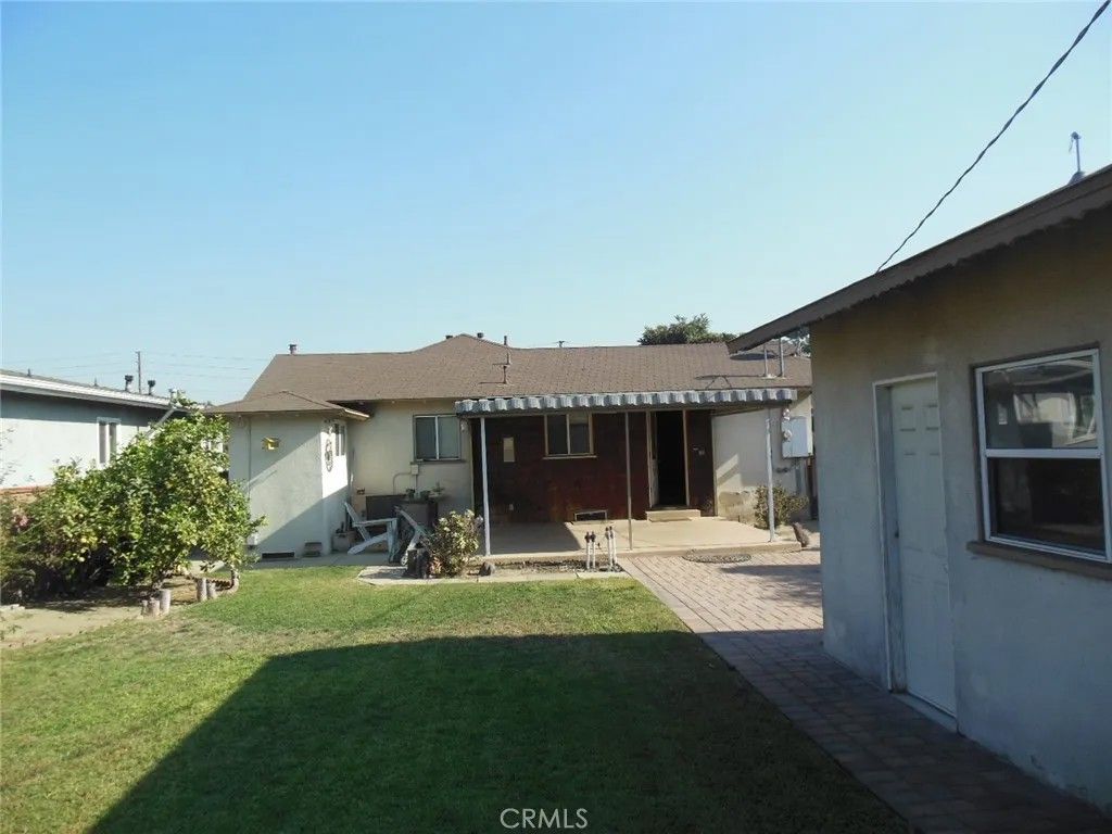 Photo of 9933 Tristan Dr, Downey, CA 90240 (MLS # PW26028806)