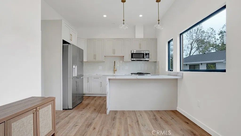 Photo of 12752 Martha Ann Dr, Los Alamitos, CA 90720 (MLS # NP26072124)