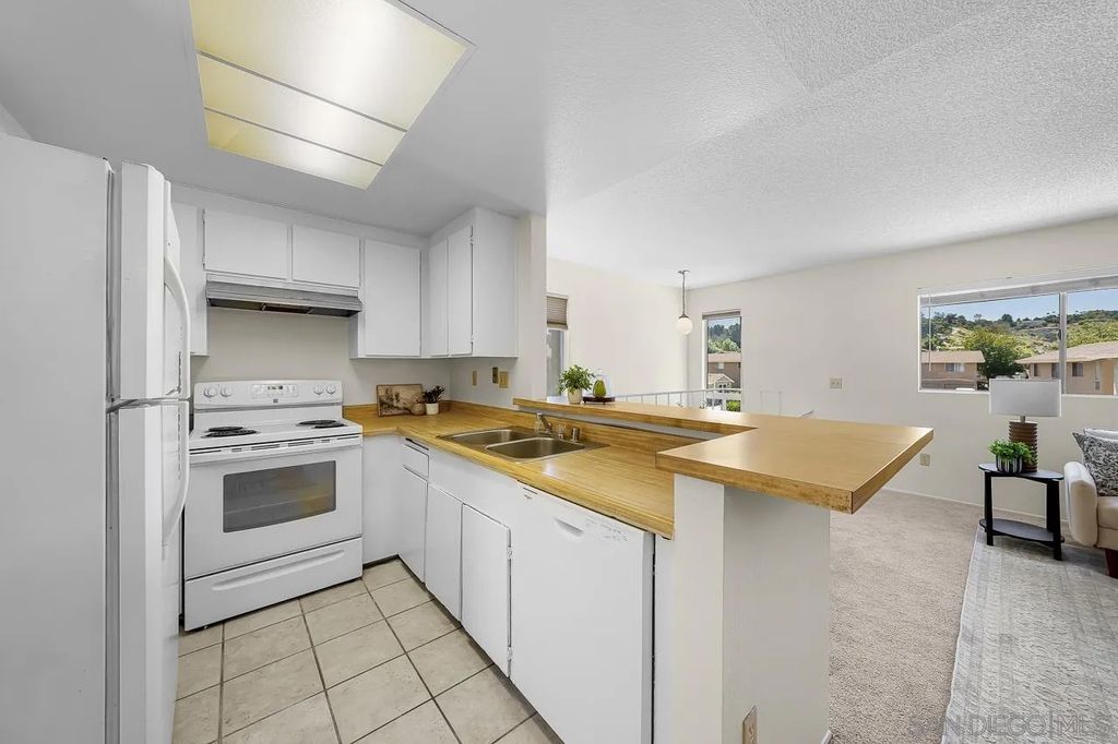 Photo of 995 Amistad Pl #D, El Cajon, CA 92019 (MLS # 260010258)