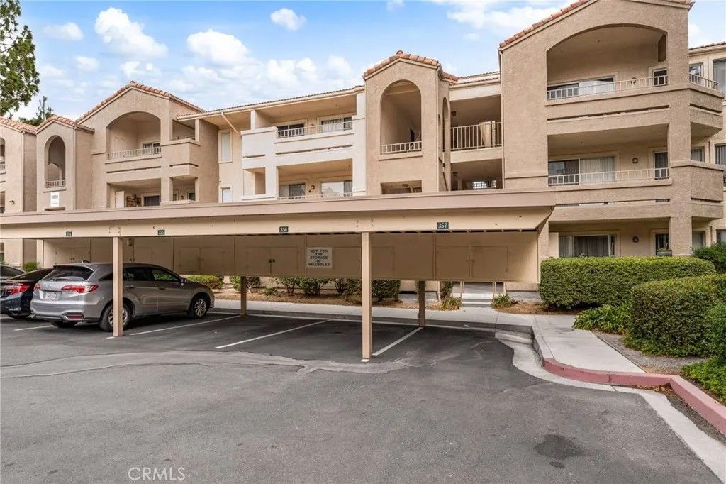 Photo of 1020 La Terraza Cir. #102 Cir, Corona, CA 92879 (MLS # CV26069032)