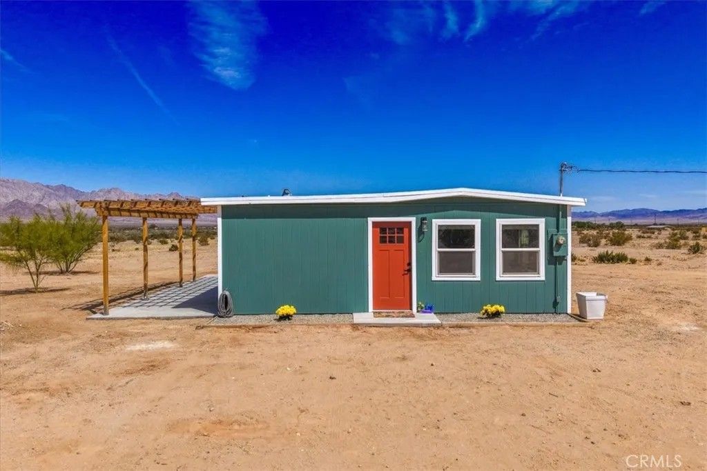 Photo of 84320 Mccombie Rd, 29 Palms, CA 92277 (MLS # JT26093620)