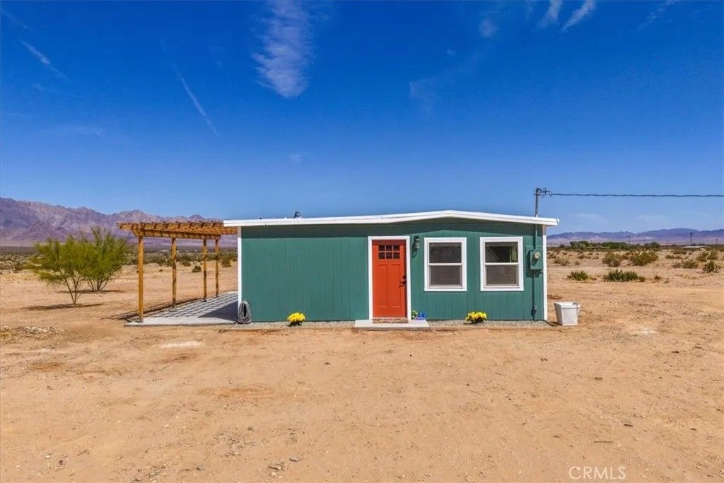 Photo of 84320 Mccombie Rd, 29 Palms, CA 92277 (MLS # JT26093620)