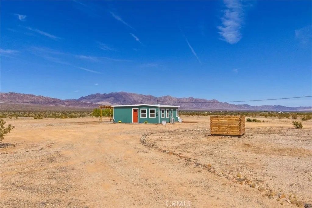 Photo of 84320 Mccombie Rd, 29 Palms, CA 92277 (MLS # JT26093620)