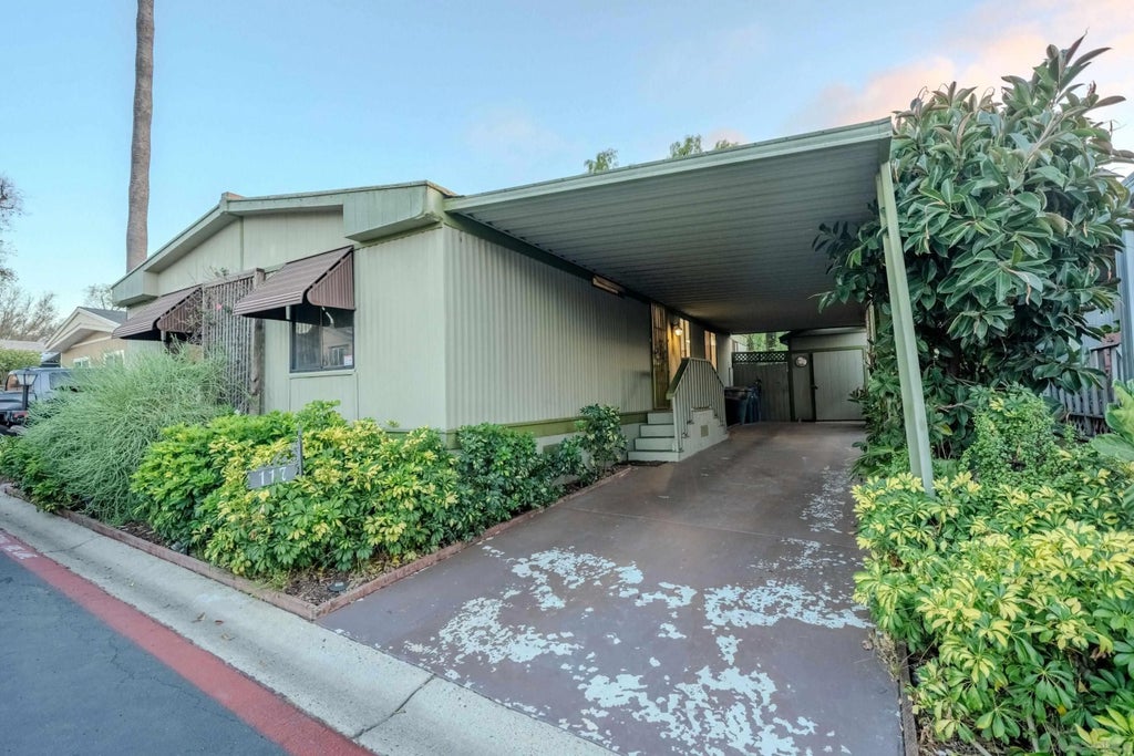 Photo of 155 Las Flores Dr DR #117, San Marcos, CA 92069 (MLS # 260024614)