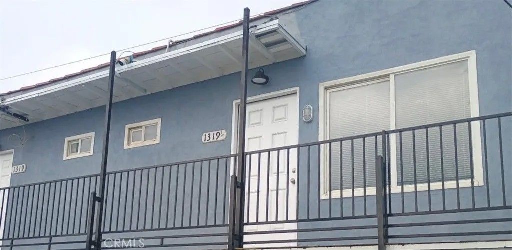 Photo of 1319 W 92nd St, Los Angeles, CA 90044 (MLS # SB26040350)