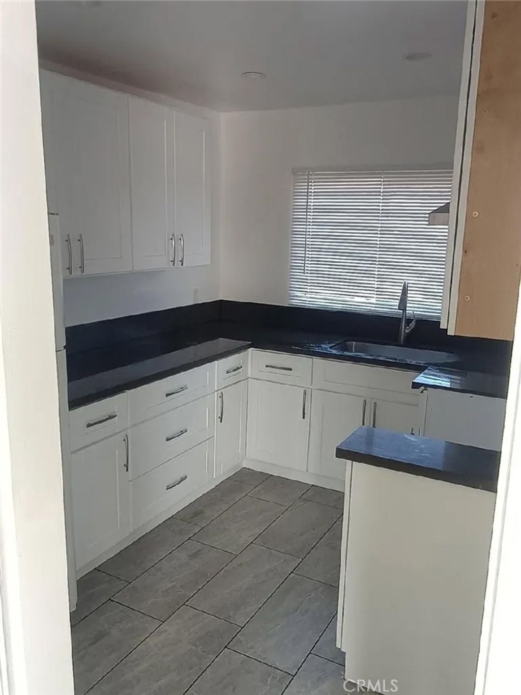 Photo of 1319 W 92nd St, Los Angeles, CA 90044 (MLS # SB26040350)