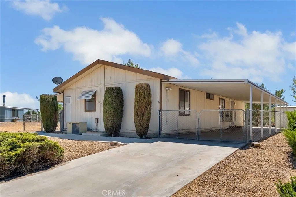 Photo of 13866 Tam O Shanter Drive, Victorville, CA 92395 (MLS # HD26123644)